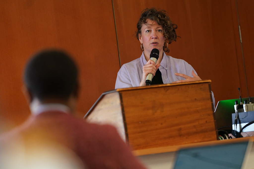Rebekka Saeter with a microphone talking to an audience