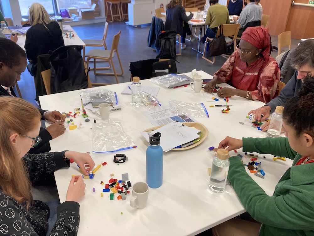 The team start building their values using LEGO.