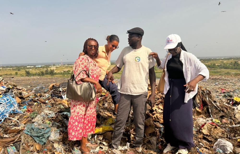 Research team stand on top the dumpsite platform. 