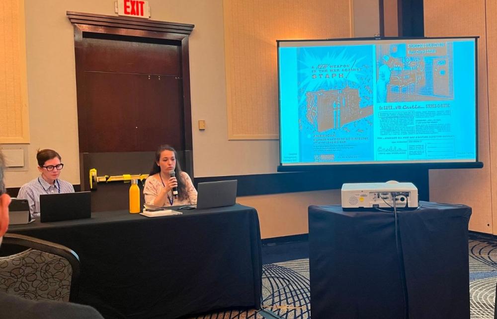 Eloïse Richards sat at the panellists table, presenting her research